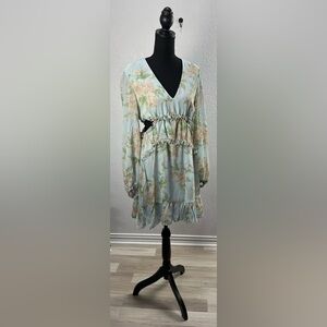 This is a She + Sky floral long sleeve dress cutout sides ruffle detail Sz M